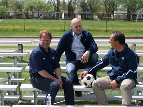 Three figures in a unique approach to coaching spend a few leisure moments after discussing the decision to have one person serve as head coach of both soccer teams at Concordia University College. Left to right are associate men’s coach Ian Skitch, whose signing was announced Tuesday, athletic department leader Joel Mrak and 15-year Concordia soccer veteran Franco Imbrogno. (Supplied)