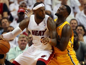 Heat star LeBron James (left) dribbles against Pacers' Lance Stephenson in the East final. (AFP)