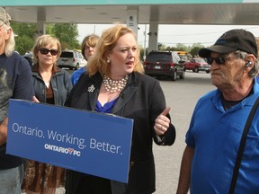 Ontario Conservative candidate for Nepean-Carleton Lisa MacLeod stands with supporters at a south-end gas station where she attacked the Liberal plan for a new provincial retirement pension plan, which she called a "job tax." 
(DOUG HEMPSTEAD/Ottawa Sun)