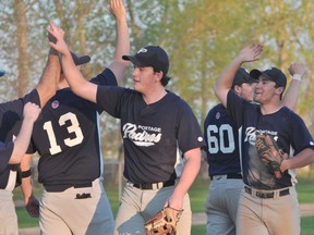 The Portage Padres celebrate their 3-2 win over Minnedosa May 27. (Kevin Hirschfield/THE GRAPHIC)