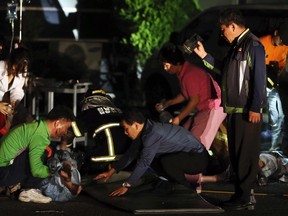 Hospital officials rescue a victim of the fire at a hospital in Jangseong, southwest region of Jeolla May 28, 2014. A fire at a rural South Korean hospital for chronically ill elderly patients on Wednesday killed 21 people and injured eight in the second major fire this week as the country still mourns victims of a ferry disaster last month. REUTERS/Hyung Min-woo/Yonhap