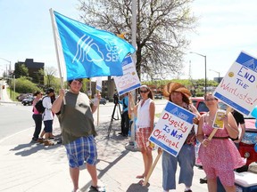 JOHN LAPPA/THE SUDBURY STAR/QMI AGENCY 
OPSEU developmental services workers and their supporters participated in a rally and barbecue in downtown Sudbury, ON. on Tuesday, May 27, 2014. The union and workers believe developmental services are in "deep crisis" and are underfunded.