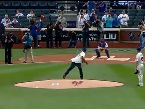 Just a bit outside: 50 Cent botches the first pitch at Citi Field in New York on Tuesday, May 27, 2014. (YouTube screenshot)
