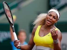 Serena Williams of the U.S. reacts during her women's singles match against Garbine Muguruza of Spain at the French Open tennis tournament at the Roland Garros stadium in Paris May 28, 2014. (REUTERS)