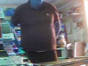 Cops released this image of a suspect in Osgoode and North Gower store robberies last week. He might have been driving a gold Nissan Altima, and it might have damage to a side window. (Submitted image Ottawa Police)