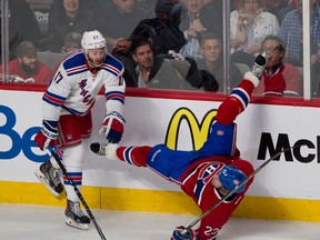 Rangers forward John Moore knocks Canadiens winger Dale Weise to the ice during first period action in Game 5 of the Eastern final at Montreal on Tuesday, May 27, 2014. (Pierre-Paul Poulin/QMI Agency)