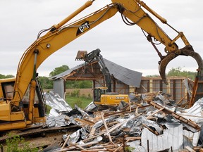 Two of Frank Meyers' farm buildings are being torn down on Meyers Creek Road in Quinte West, Ont. Wednesday morning, May 28, 2014. - Jerome Lessard/The Intelligencer/QMI Agency