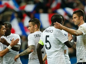 France's national soccer team players celebrate after beating Norway in their international friendly at Stade de France Stadium in Saint-Denis, near Paris, on Tuesday, May 27, 2014. (Charles Platiau/Reuters)