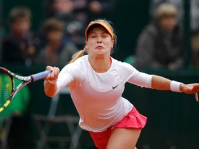 Eugenie Bouchard returns a forehand to Julia Goerges during their women's singles match during the French Open at Roland Garros stadium in Paris May 28, 2014. (REUTERS/Stephane Mahe)