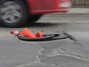 A pothole on Dufferin St. at Alma Ave., north of Queen St W. (Toronto Sun files)