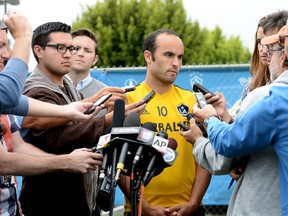 Landon Donovan speaks to the media at an L.A. Galaxy practice on his omission from the Team USA roster on May 24. (Reuters)