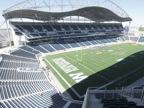 The woman and a 30-year-old man were formally charged with assaulting the officer on Aug. 26. Under the conditions of their release, both are banned from attending events at Investors Group Field.