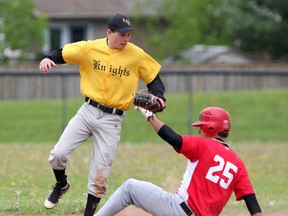 La Salle Black Knights second baseman Dusty Moreland jumps out of the way of a sliding Marc Beckstead from St. Joseph's Panthers of Cornwall during Eastern Ontario Secondary Schools Athletic Association baseball action at Woodbine Park on Wenesday. (IAN MACALPINE/THE WHIG-STANDARD)