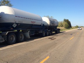 A semi-trailer pulled off the highway Tuesday, May 27, after its load caught ablaze. It was carrying anhydrous ammonia, a farm fertilizer that's not only quite flammable but also toxic. (HANDOUT)