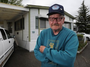 Long time resident Rudy Prediger stands outside his home fuming at the situation he and his neighbours are being put in by the City of Calgary as they were informed they will have to move from the Midfield Mobile Home Park in northeast Calgary Alta on Wednesday May 28, 2014. Prediger has lived at the park for more than 40 years and was given a letter by the city that he has to move by Sept. 30, 2017. Stuart Dryden/Calgary Sun/QMI Agency