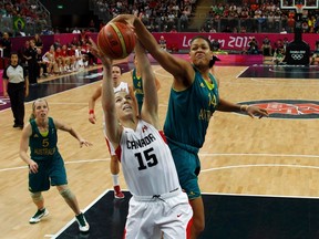 Michelle Plouffe fights for the rebound during preliminary round action at the London Olympics in 2012. (Reuters)
