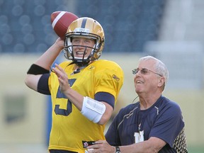 Winnipeg Blue Bombers quarterback Drew Willy (l) gets some help from quarterbacks coach Gene Dahlquist during CFL practice in Winnipeg, Man. Wednesday May 28, 2014.
Brian Donogh/Winnipeg Sun/QMI Agency