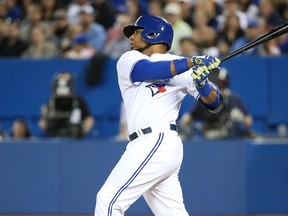 Blue Jays’ Edwin Encarnacion hits a two-run single in the first inning against the Rays at the Rogers Centre last night. (AFP)