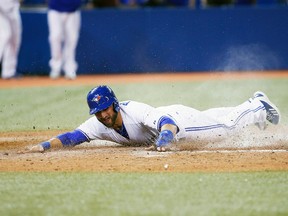 Toronto Blue Jays pinch runner Kevin Pillar scores on a throwing error against the Tampa Bay Rays at the Rogers Centre in Toronto, May 28, 2014. (JOHN E. SOKOLOWSKI/USA Today)