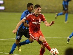 Toronto FC midfielder Bradley Orr gets past Montreal Impact midfielder Patrice Bernier on May 28. (Dan Hamilton-USA TODAY Sports)