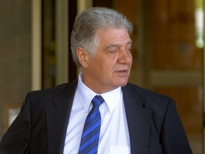 London Mayor Joe Fontana leaves the London Courthouse on a lunch break after spending the morning testifying at his trial in London, Ontario on Wednesday May 28, 2014 (MORRIS LAMONT, The London Free Press)