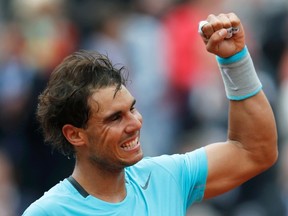 Rafael Nadal celebrates after winning his match against Dominic Thiem at the French Open in Paris on Thursday, May 29, 2014. (Jean-Paul Pelissier/Reuters)
