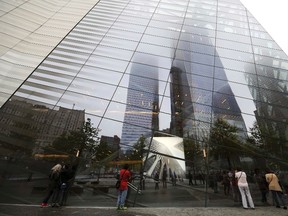 An image of one of the original World Trade Center Towers is displayed in the window of the  9/11 Memorial Museum pavilion during the dedication ceremony at the National September 11 Memorial Museum in New York, May 15, 2014.  REUTERS/ Anthony Behar/Pool