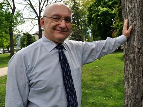 Ivan Listar, London’s urban forester, leans against a tree in Victoria Park May 28, 2014. CHRIS MONTANINI\LONDONER\QMI AGENCY