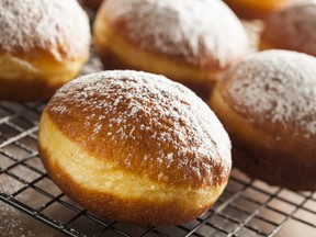 Homemade Raspberry Polish Paczki Donut with Powdered Sugar (fotolia)