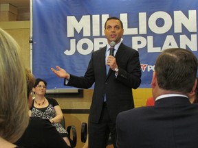 PC Leader Tim Hudak speaks to a town hall of hairstylists Tuesday May 27 2014 at a First Choice Haircutters in Pickering. (Antonella Artuso/QMI Agency)