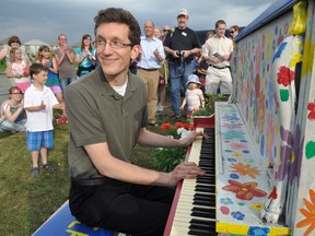 Pianist Eli Pasic plays a tune on London’s first community piano in Hyde Park May 28, 2014. CHRIS MONTANINI\LONDONER\QMI AGENCY