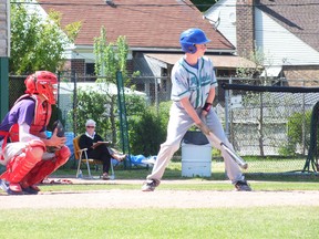 St. Patrick's ball player Jamie Devereaux steps into the batter's box in the first inning of Thursday's LSSAA championship. St. Patrick's defeated St. Clair 10-5. BRENT BOLES / THE OBSERVER / QMI AGENCY