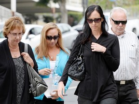 (L-R) Ann Stow, mother, Erin Collins and Bonnie Stow, sisters, and David Stow, father, of San Francisco Giants fan Bryan Stow arrive for the start of a civil trial in a lawsuit brought by Stow against former Los Angeles Dodgers owner Frank McCourt at a Los Angeles Court in Los Angeles, California May 29, 2014. (REUTERS)