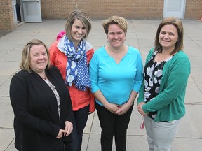 Members of a committee at Rideau Heights Public School that has been working to remove the paved play area around them and replace it with a greener playground are, from left, Tina Hagberg, Sarah Winslade, Laurie How-Khairullah and Traci Moreland. MICHAEL LEA\THE WHIG STANDARD