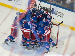 The New York Rangers celebrate after beating the Montreal Canadiens to earn a trip to the Stanley Cup. (QMI Agency)