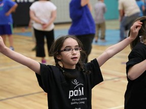 JOHN LAPPA/THE SUDBURY STAR/QMI AGENCY 
Sienna Desjardins, 8, of St. Raphael Catholic School, takes part in the Physical Activity, Healthy Living Day at St. Benedict Catholic Secondary School in Sudbury, ON. on Tuesday, May 27, 2014. St. Benedict and Special Olympics Ontario hosted the event for more than 70 elementary school special education students from the Sudbury Catholic District School Board. The students moved to 6 different stations participating in physical activities.