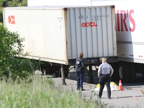 York Regional Police investigate the scene of a fatal industrial accident at a transport company in Vaughan. (DAVE THOMAS/Toronto Sun)