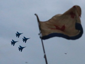 Planes from Russia's military aerobatics team 'Russian Knights' perform during events marking Victory Day, in Sevastopol May 9, 2014. REUTERS/Maxim Shemetov