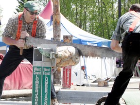 The Grove’s Wayne Paulsen (left) works with a teammate to saw through a log as quickly as possible during the West Coast Lumberjacks Show, staged in front of the Stu Barnes Arena on May 24 and 25. Paulsen was using the show to prepare himself for the Stihl Series, in Fort Saskatchewan, on June 14. - Gord Montgomery, Reporter/Examiner
