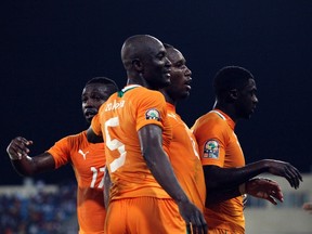 (L-R) Ivory Coast's Siaka Tiene, Didier Zokora, Didier Drogba and Kolo Toure celebrate after scoring against Burkina Faso during their African Nations Cup soccer match in Malabo January 26, 2012. (REUTERS)