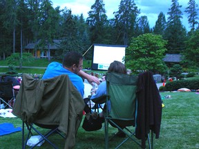 A couple enjoys a film outdoors during the Devonian Botanic Gardens’ annual Movie Date Night. - Photo Supplied