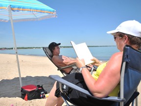 Mel and Joanne White, from Brigden, are shown relaxing  at Canatara Park beach in this 2011 file photo. FILE PHOTO/ THE OBSERVER / QMI AGENCY