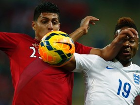 England's Raheem Sterling (right) challenges for the ball with Peru's Hansell Riojas during their international friendly at Wembley Stadium in London May 30, 2014. (REUTERS/Eddie Keogh)