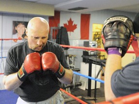 Frank White backs his sparring partner Dylan Matthews into the corner while training on May 10, 2012 at River City Boxing Club in Sarnia, Ont. White is currently preparing for an international bout in Finland on June 7. White will be taking on Finnish national Juho Haapoja.  (Observer file photo)