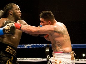 Canadian Bermane Stiverne (left) fights Chris Arreola for the WBC world heavyweight championship at the USC Galen Center in Los Angeles May 10, 2014. (TIM BRADBURY/QMI Agency)