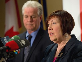 London police inspector Kevin Heslop and Children's Aid Society executive director Jane Fitzgerald speak about the rescue of a 10-year-old boy held captive for 18-24 months in London, Ont. on Friday May 30, 2014. (DEREK RUTTAN, The London Free Press)