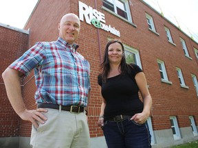 Home Base Housing executive director Tom Greening and Youth Services Program supervisor Tara Everitt stand in front of the agency's youth apartment building RISE@one4nine on Kingscourt Avenue. Home Base's youth program was the winner of a national award for its work with youth homelessness. (Elliot Ferguson/The Whig-Standard)