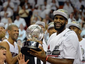 Miami Heat centre Greg Oden holds up the conference championship trophy after defeating the Indiana Pacers in Game 6 of the Eastern Conference final Friday at American Airlines Arena. (Steve Mitchell/USA TODAY Sports)