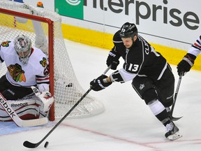 Chicago Blackhawks goalie Corey Crawford defends the goal against Los Angeles Kings forward Kyle Clifford (13) during Game 6 of the Western Conference final Friday at Staples Center. (Gary A. Vasquez/USA TODAY Sports)