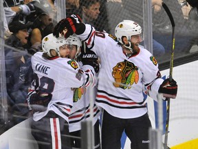 Chicago Blackhawks players celebrate a third-period goal on Friday night against the Los Angeles Kings. (Gary A. Vasquez/USA TODAY Sports)